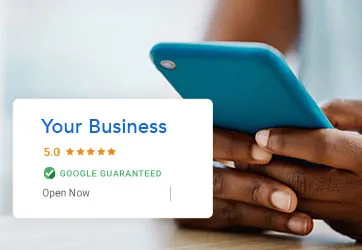 A phone showing a five-star Google Guaranteed business listing